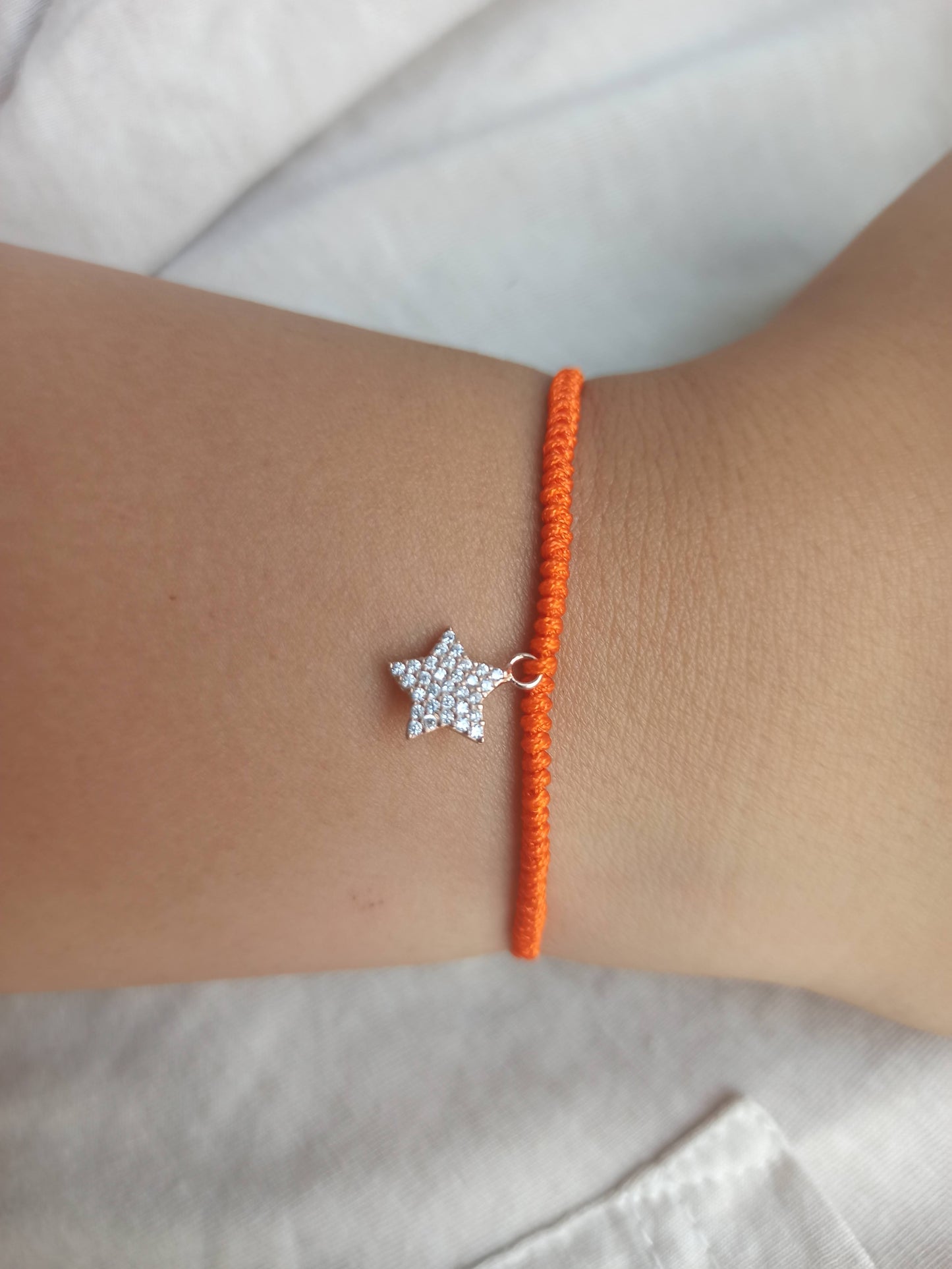 Taşlı gümüş yıldız  turuncu ipli bileklik